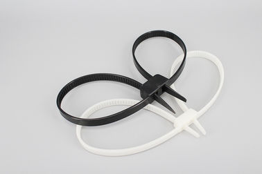 China 12*700mm white and black strong double loop Unbreakable soft plastic cable tie one time police handcuffs supplier